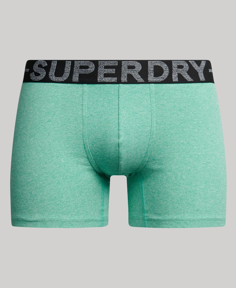 pacote com três cuecas boxer de algodão orgânico nas cores preto mesclado verde mesclado e verde fresco mesclado.