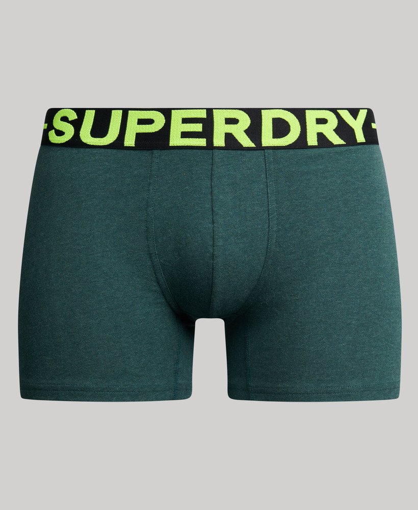 pacote com três cuecas boxer de algodão orgânico nas cores preto mesclado verde mesclado e verde fresco mesclado.
