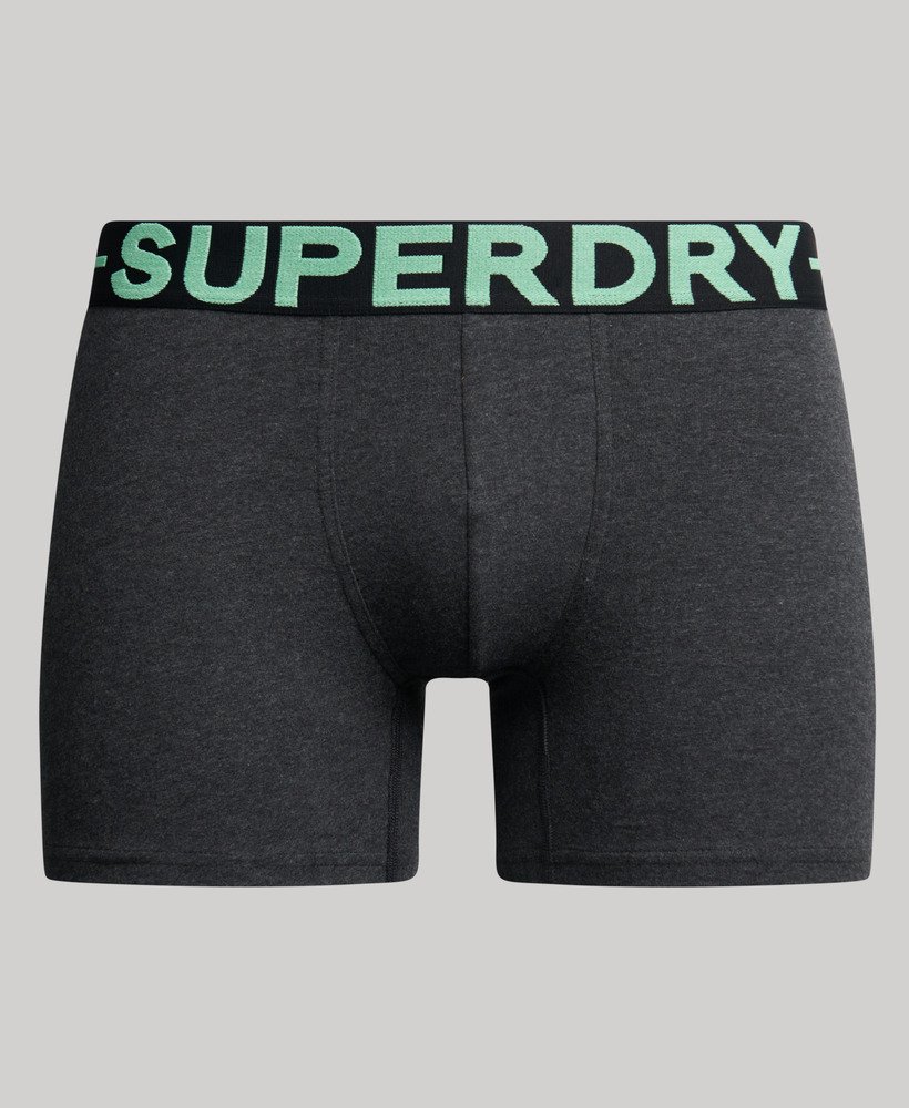 pacote com três cuecas boxer de algodão orgânico nas cores preto mesclado verde mesclado e verde fresco mesclado.