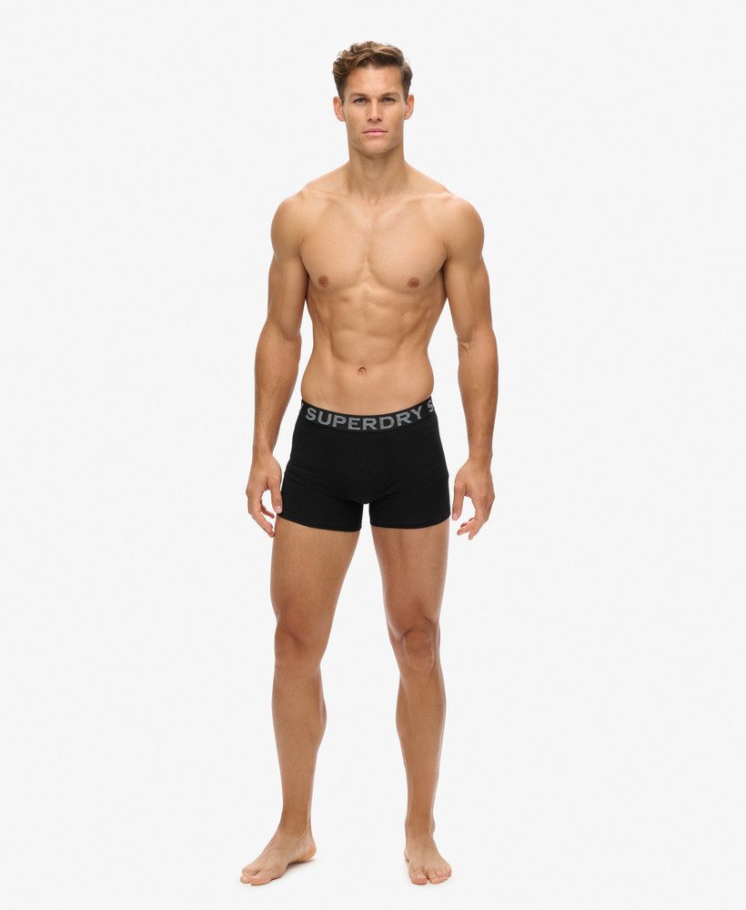 pacote com três cuecas boxer de algodão orgânico nas cores pretolaranja.