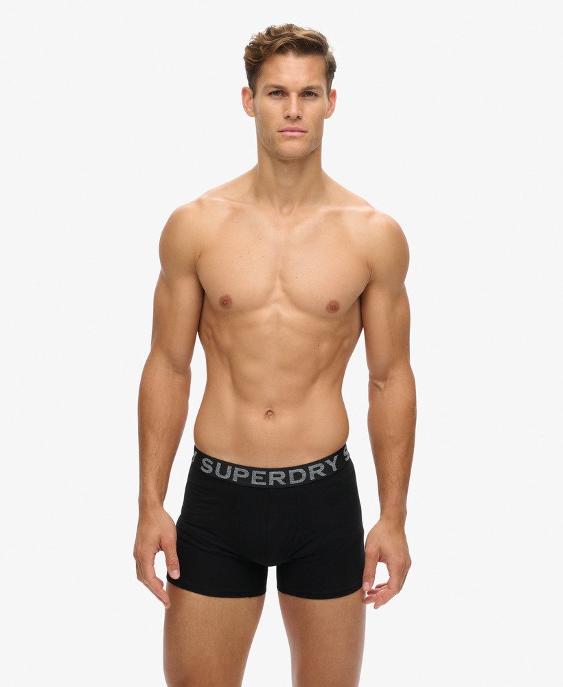 pacote com três cuecas boxer de algodão orgânico nas cores pretolaranja.